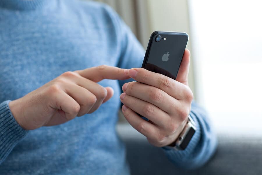 man with a iphone on the hand