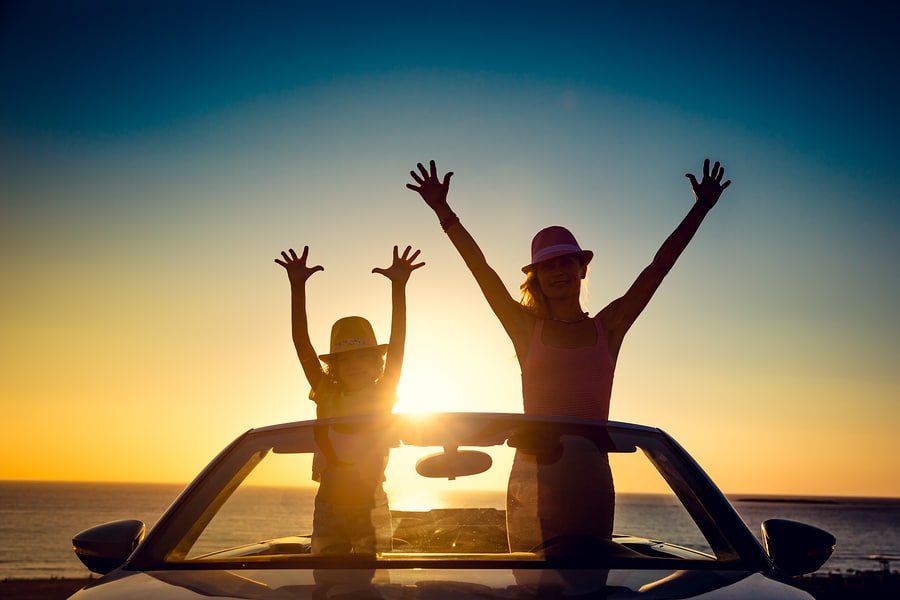 Silhouette Of Happy Family At The Beach